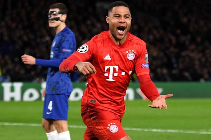 Serge Gnabry celebrates as he scored in the Champions League first leg against Chelsea in London